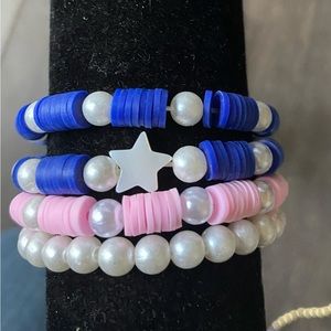 Bracelet set of four, pearl themed.